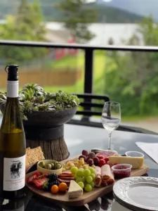 wine and charcuterie on patio overlooking shuswap lake