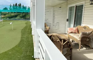 putting green and patio seating at haskap farms vacation rental suite