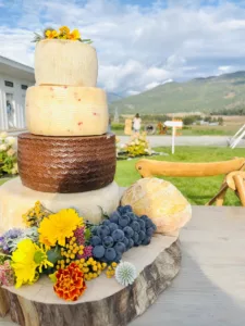 stacked cheese wheels like a wedding cake